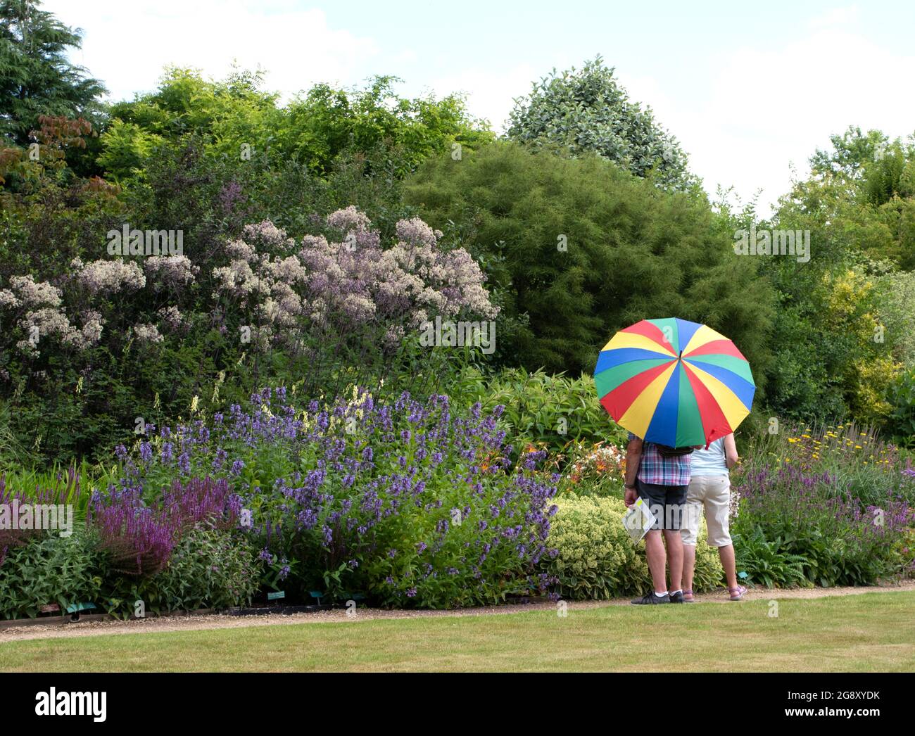 Visitors looking at one of the borders at Breezy Knees Gardens Stock Photo