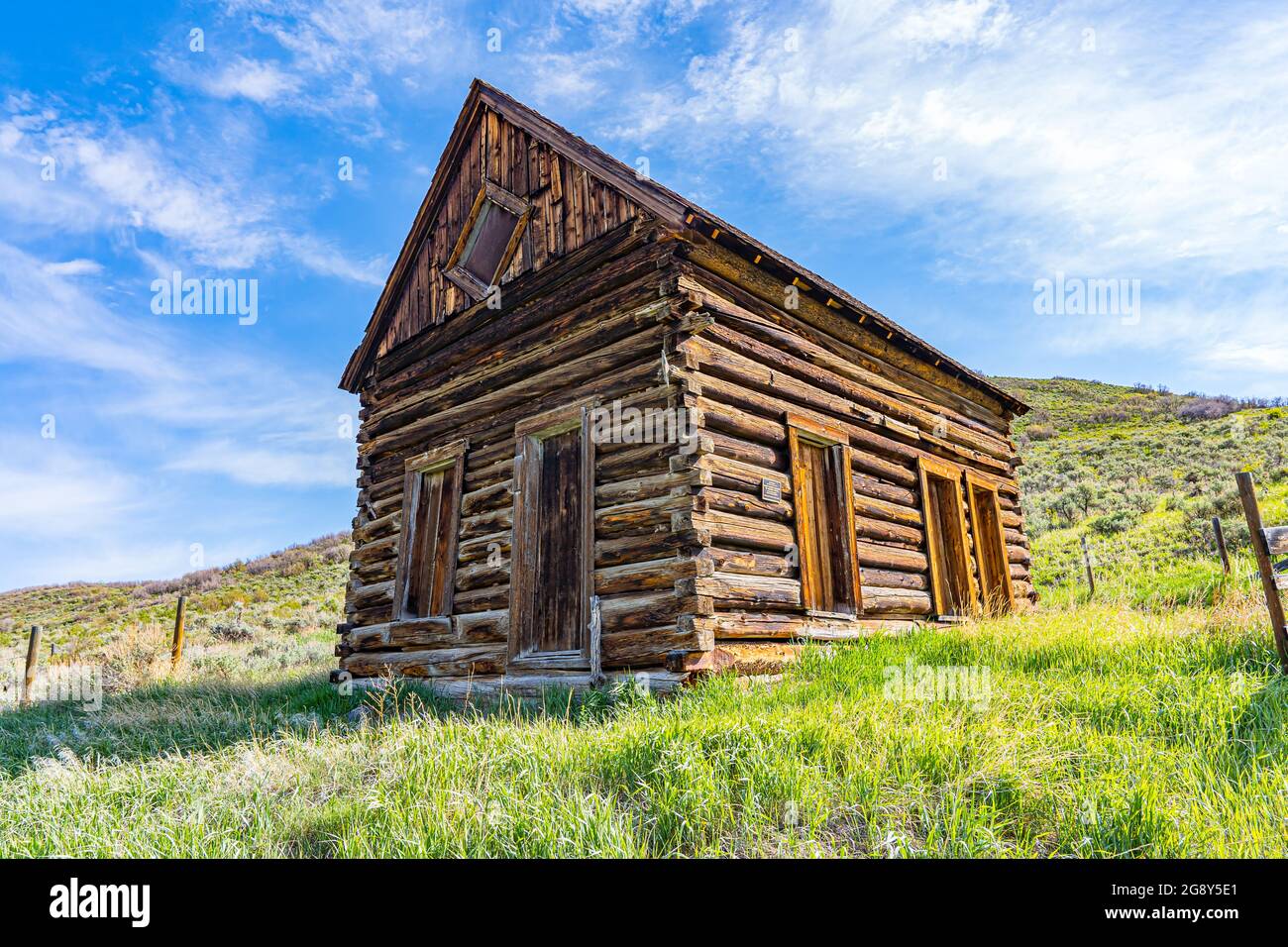 Old abandoned log homestead cabin in mountains of Colorado Stock Photo