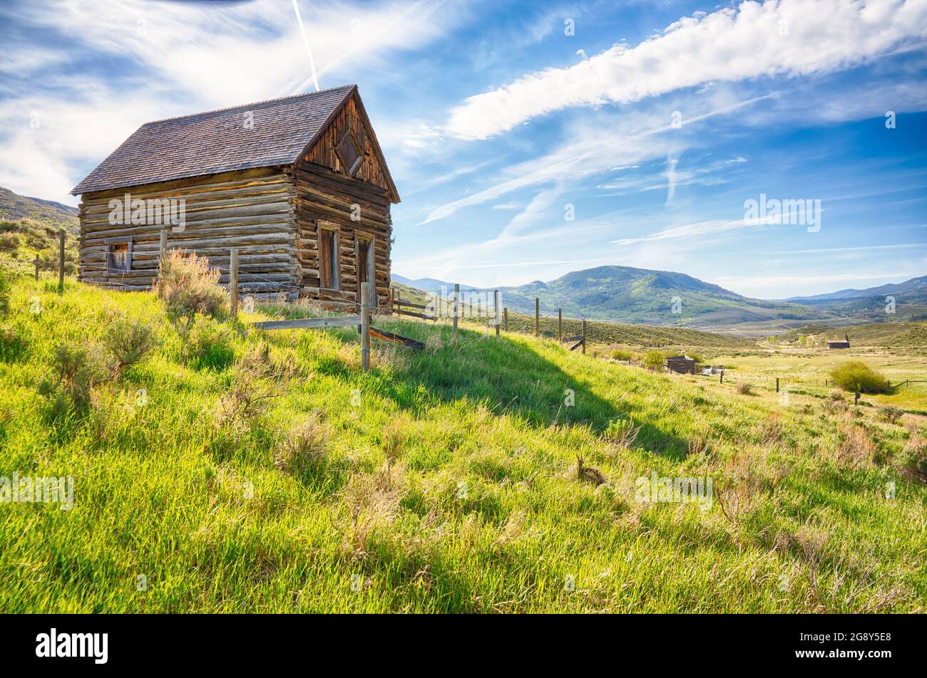 Old abandoned log homestead cabin in mountains of Colorado Stock Photo