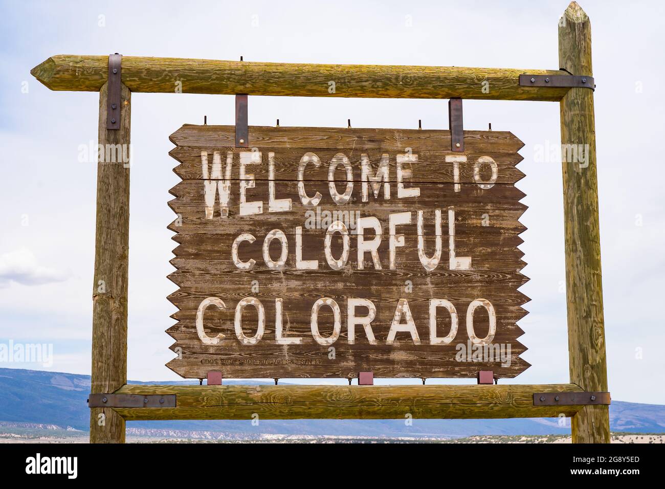 Welcome to colorful Colorado sign along the road at the Colorado and Utah border. Stock Photo