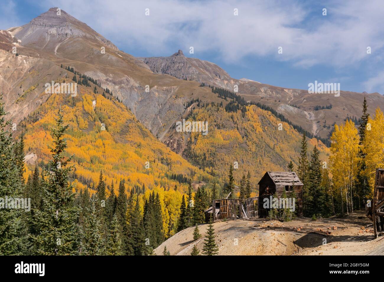 Ruins of the old Yankee Girl gold mine in the San Juan Mountains of Colorado during autumn Stock Photo