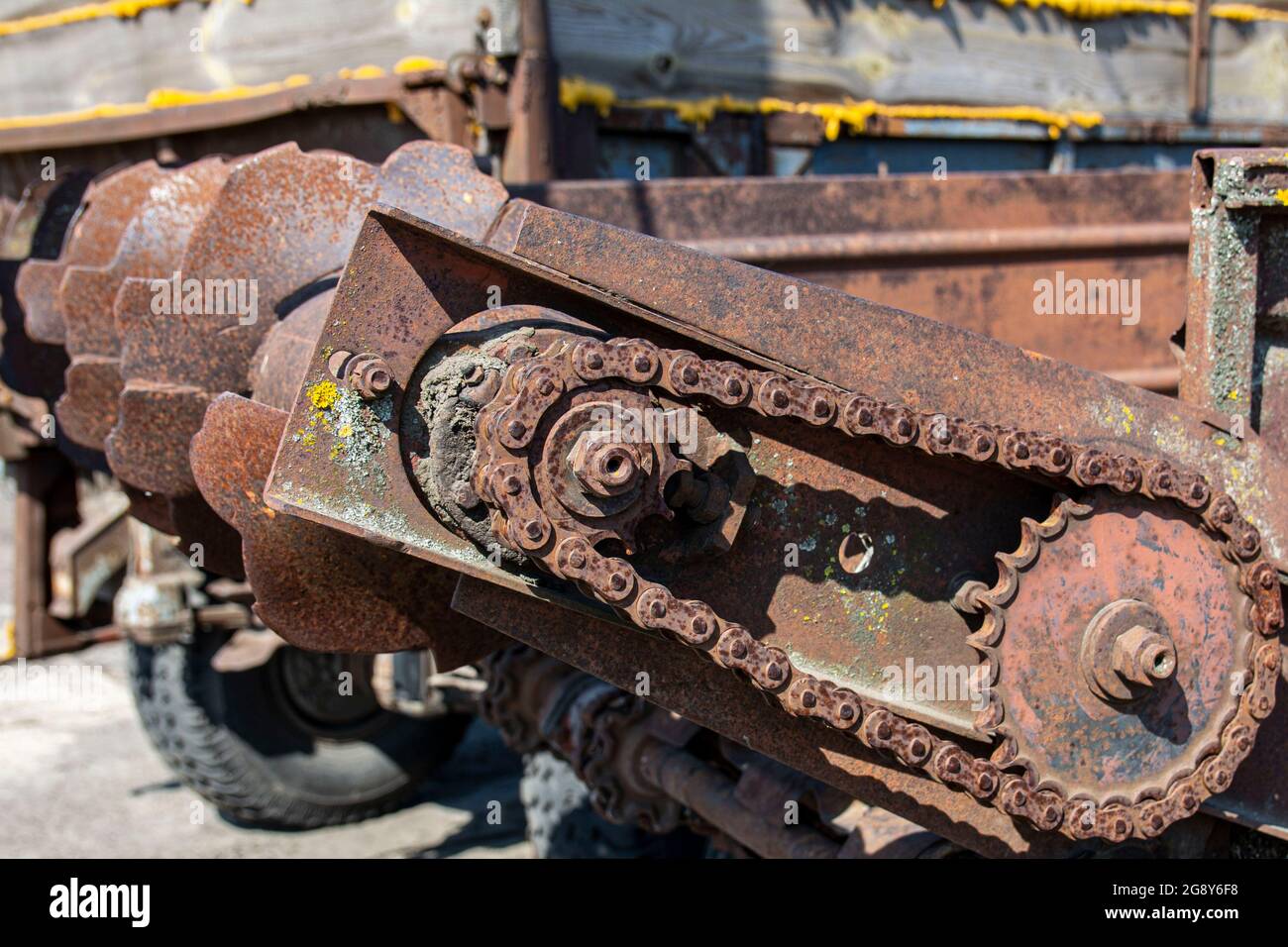 Rusty details of old abandoned cars. Gears, chains, pulleys rust in the