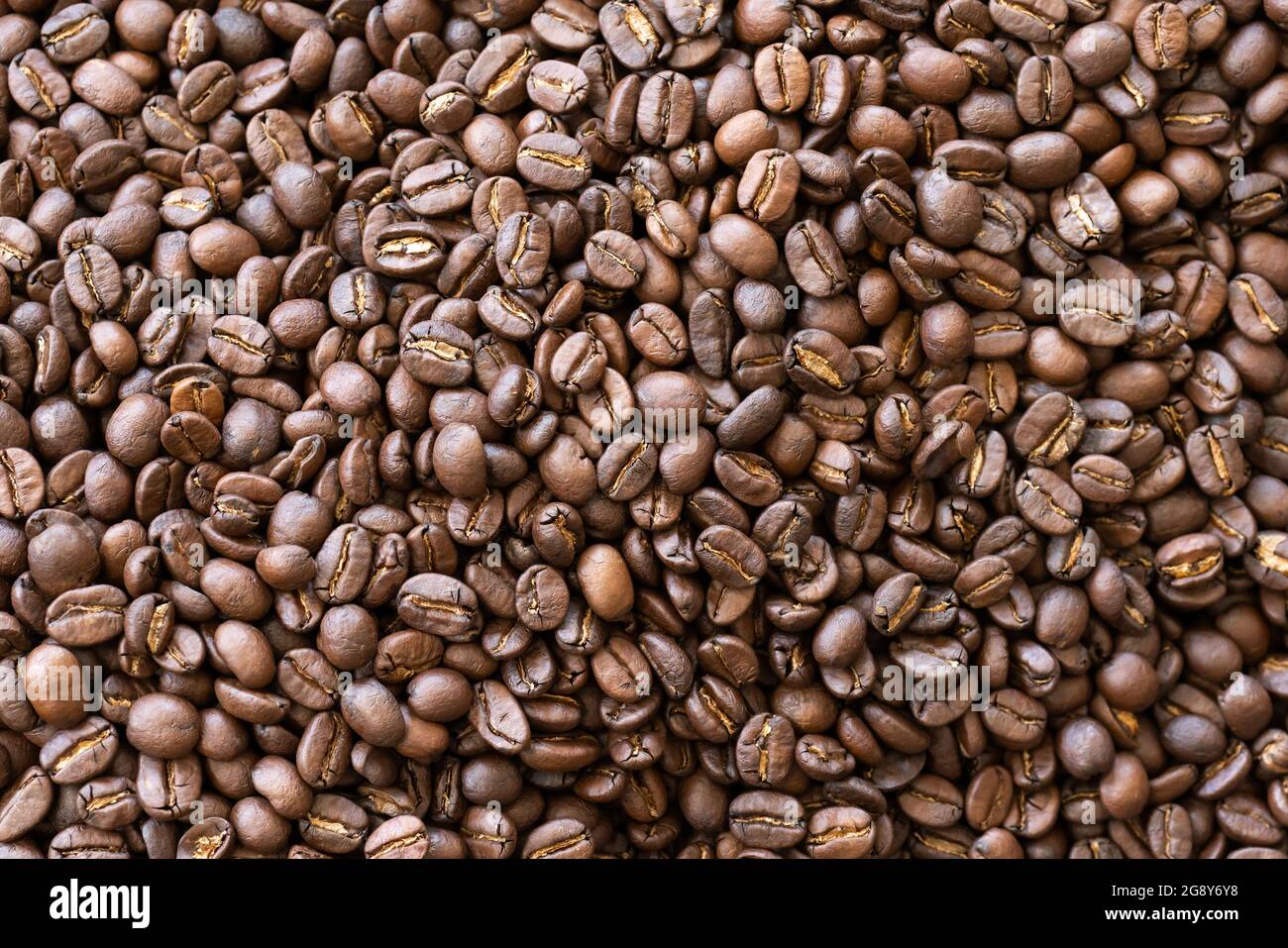 coffee beans roasted coffee beans background texture Stock Photo - Alamy