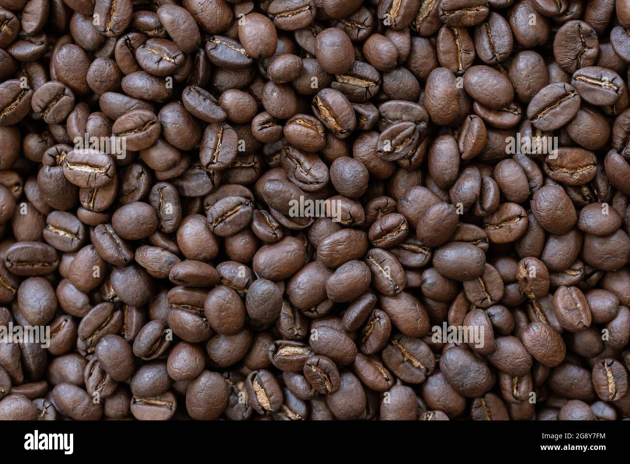 coffee beans roasted coffee beans background texture Stock Photo - Alamy
