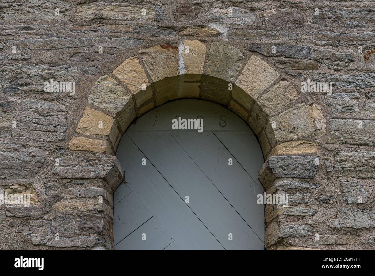 stone arch arch over the entrance to Borrie church, Sweden, July 16, 2021 Stock Photo