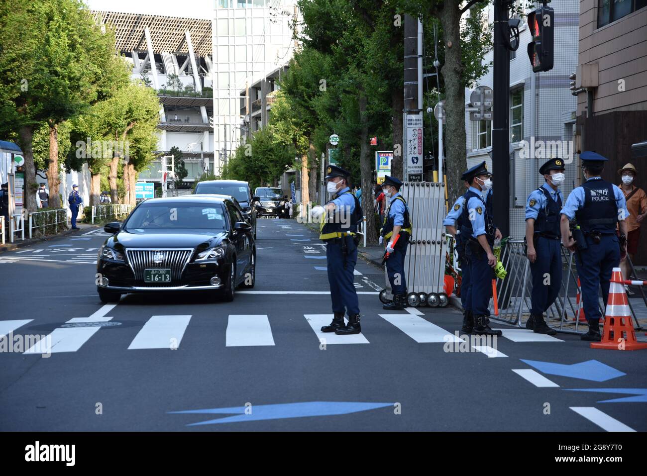 Tokyo, Japan - July 23, 2021 : Police officers guard and guide street around Tokyo Olympics Stadium Stock Photo