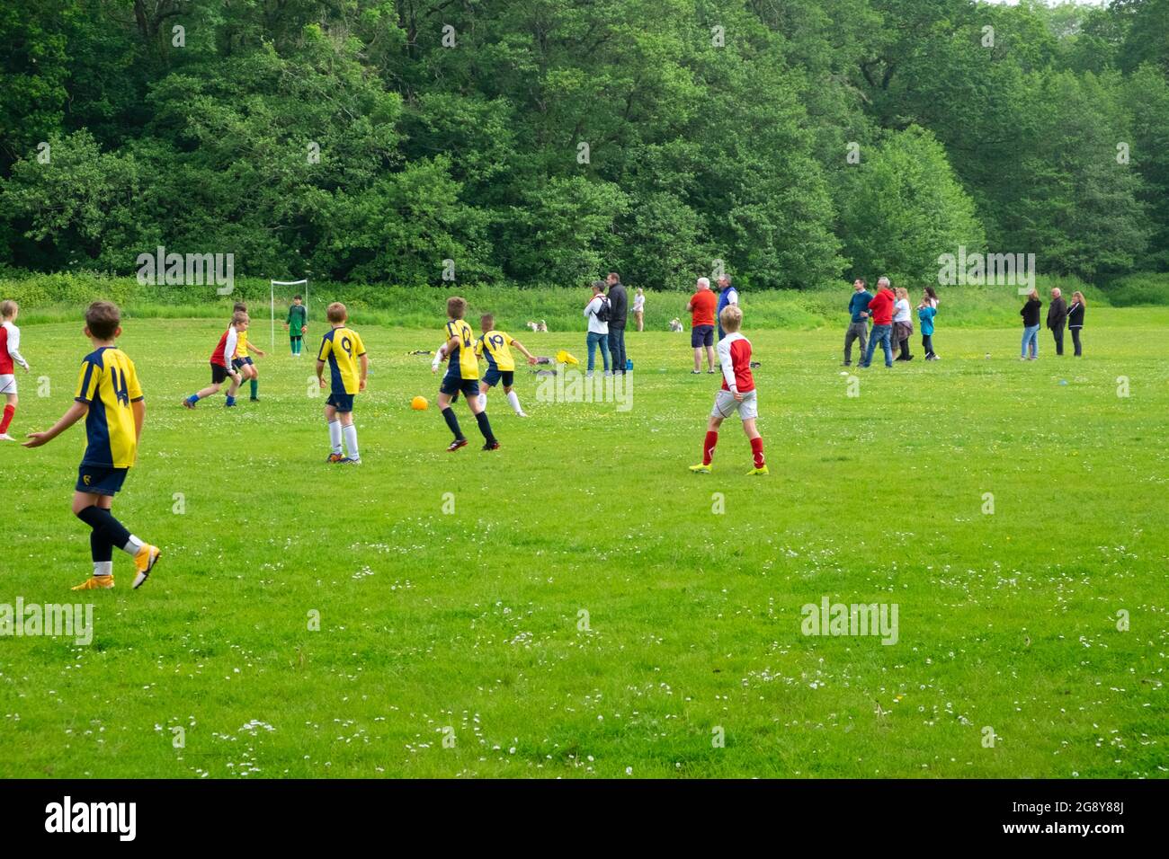 Boys teams playing football on Saturday morning in UK Great Britain ...