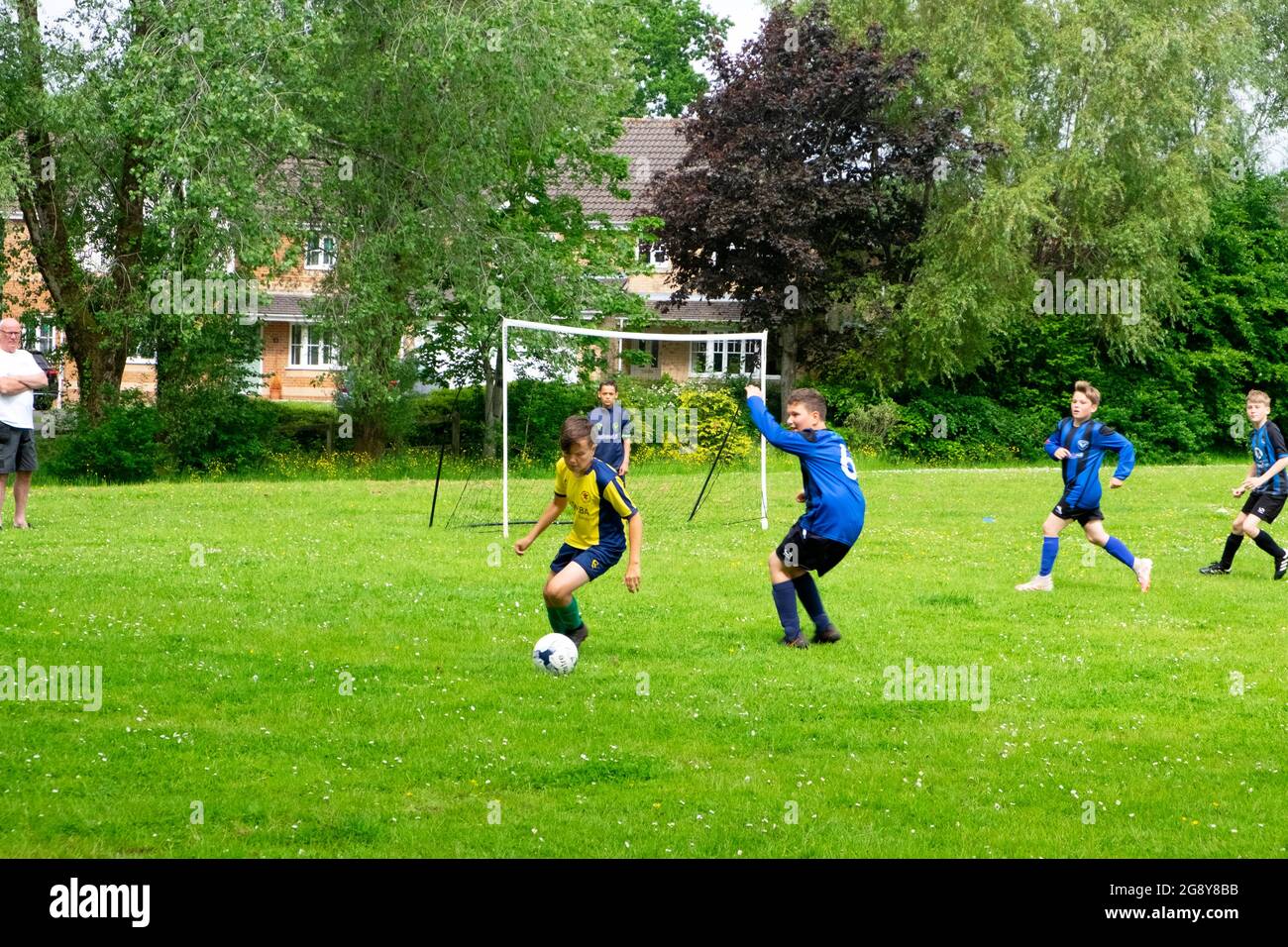 Boys teams playing football on Saturday morning in Wales UK Great Britain  2021 KATHY DEWITT Stock Photo