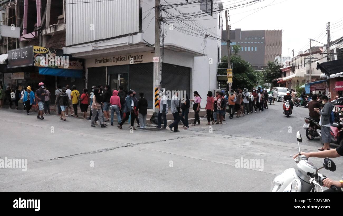 Food Handout Line for the Unemployed Out of Work Workers in Pattaya Thailand Stock Photo
