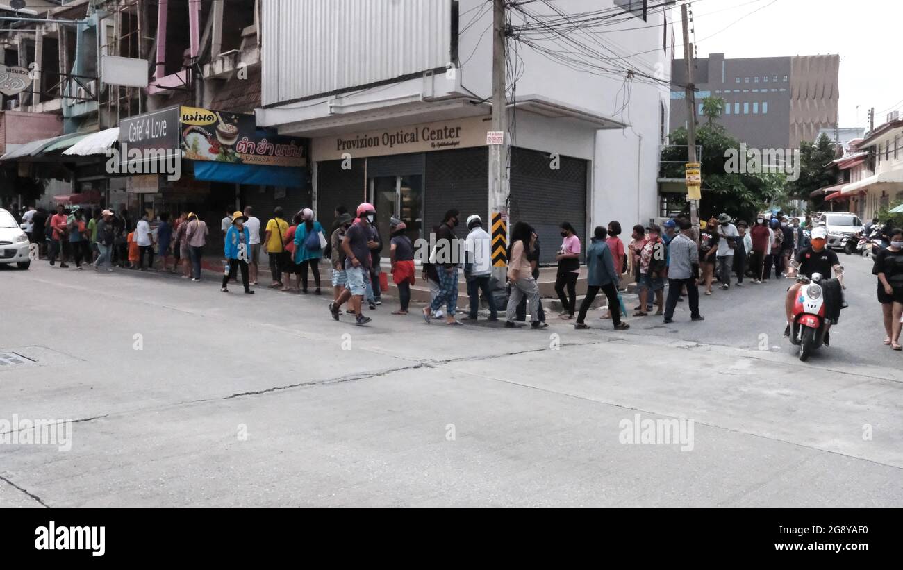 Food Handout Line for the Unemployed Out of Work Workers in Pattaya Thailand Stock Photo