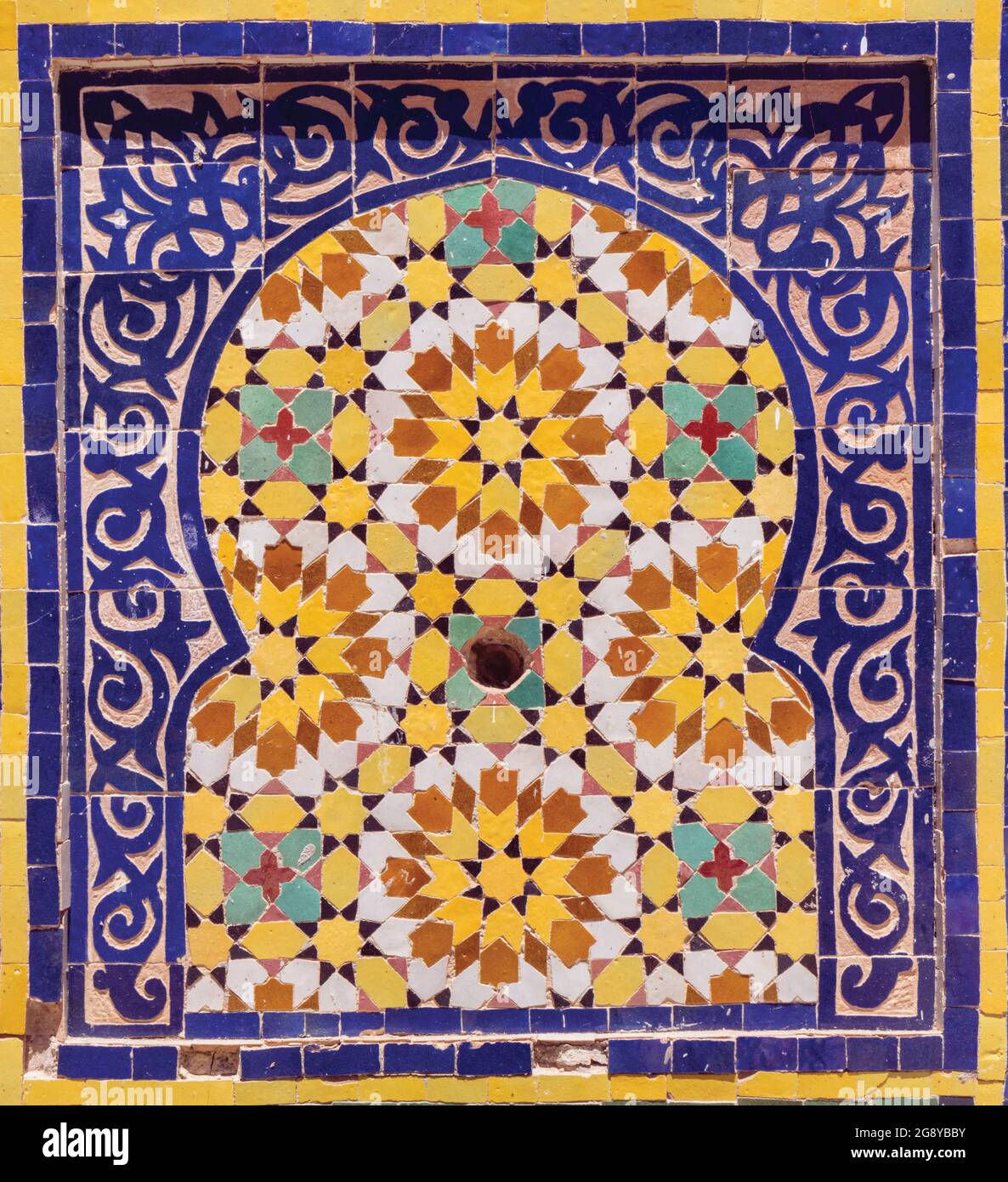 Islamic geometric patterns on a tiled fountain.  Castellar de la Frontera, Cadiz Province, Andalusia, southern Spain. Stock Photo