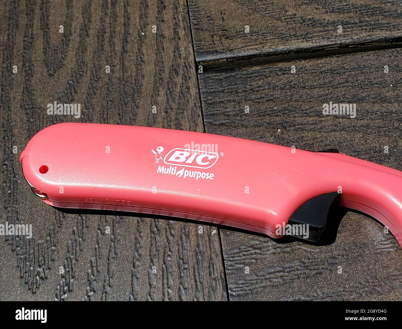 Closeup of Bic brand butane lighter on outdoor table, Lafayette