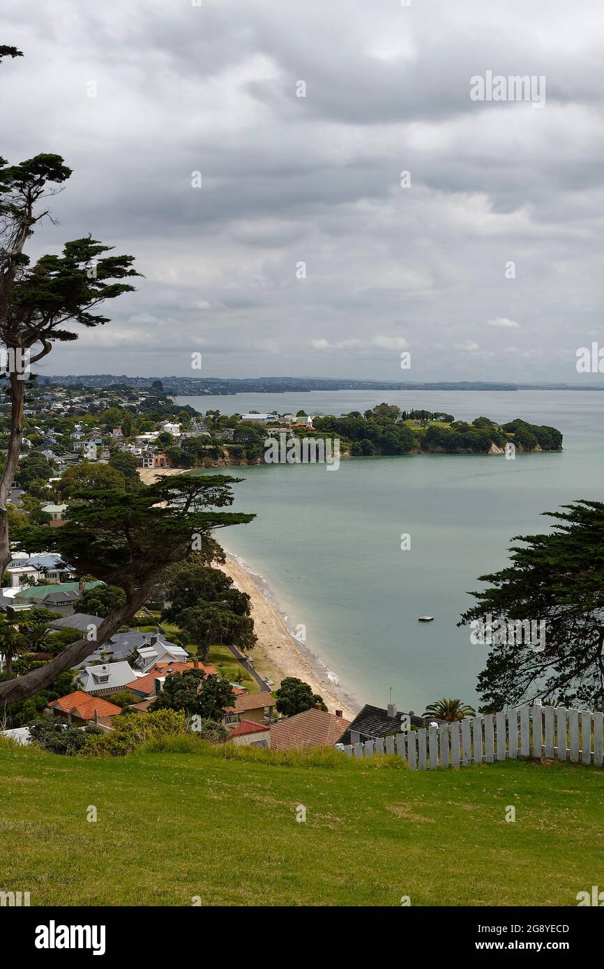 coastline, sand beach, water, houses, trees, water, cove, peninsula, cloudy sky, Devonport; views from North Head, dead space, Auckland, New Zealand Stock Photo