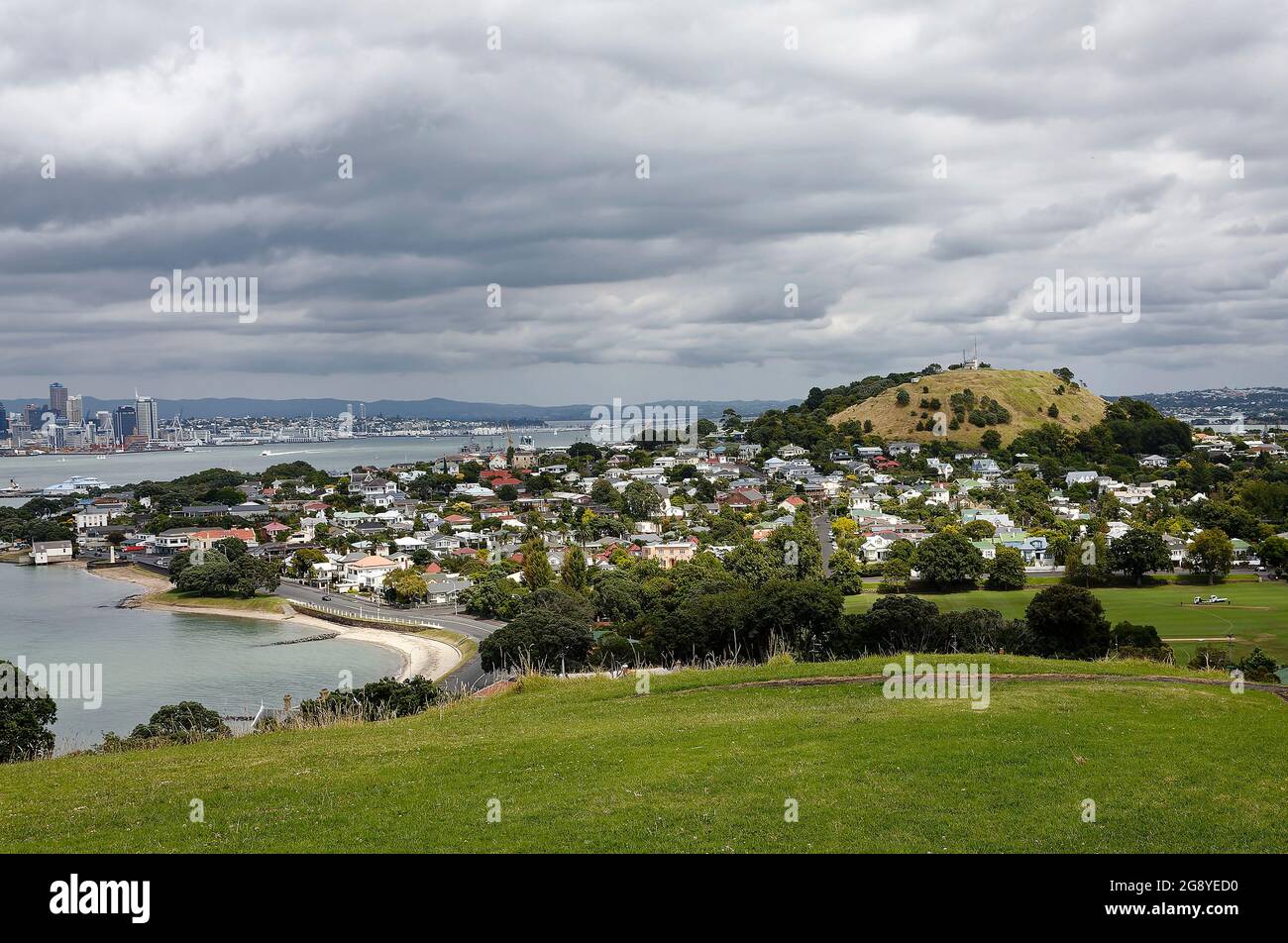 coastline, water, houses, trees, water, cove, hillside, cloudy sky, Devonport; views from North Head, dead space, downtown across waterway, Auckland; Stock Photo