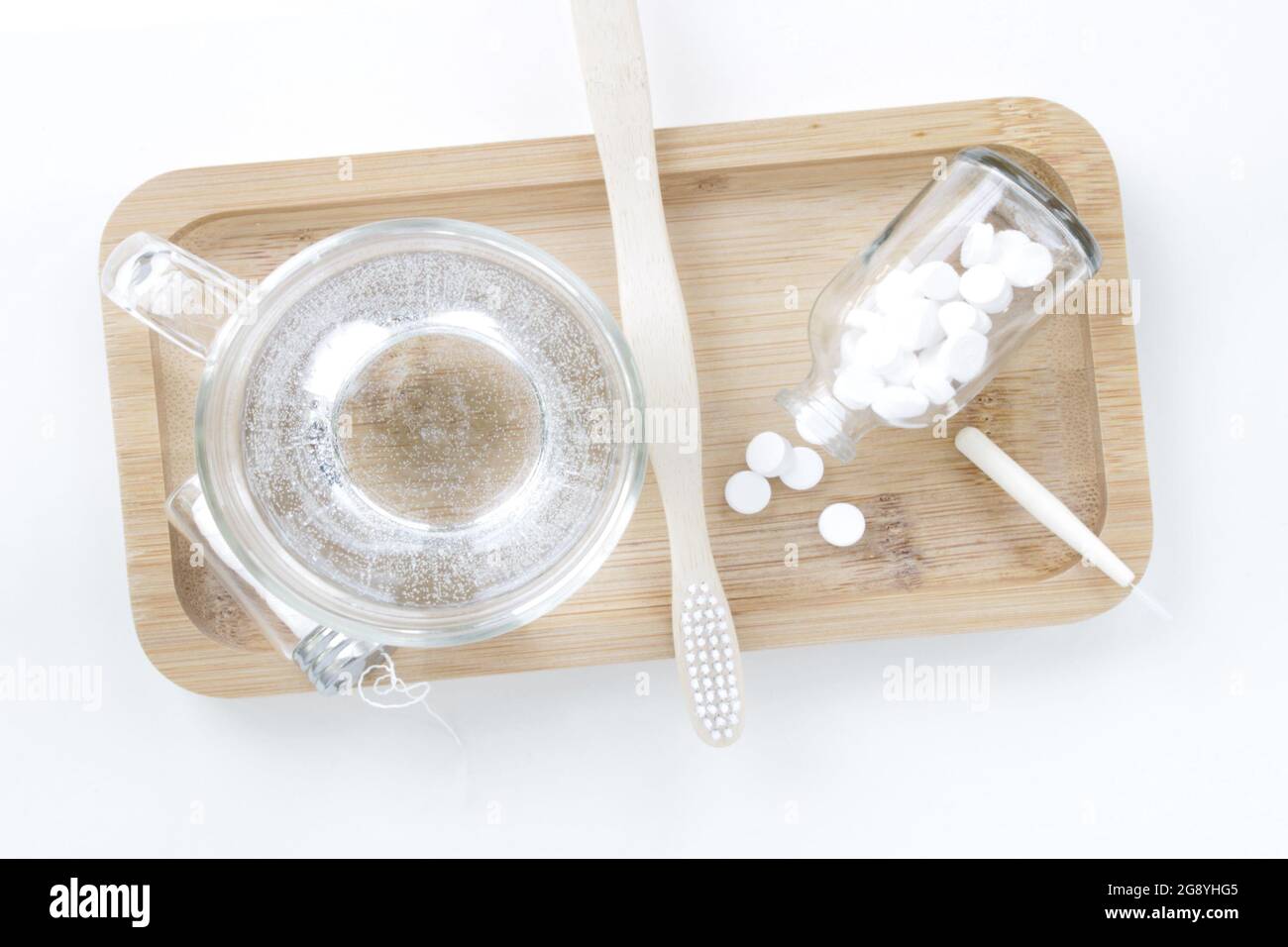 Above close up view of natural oral health care objects on a bamboo