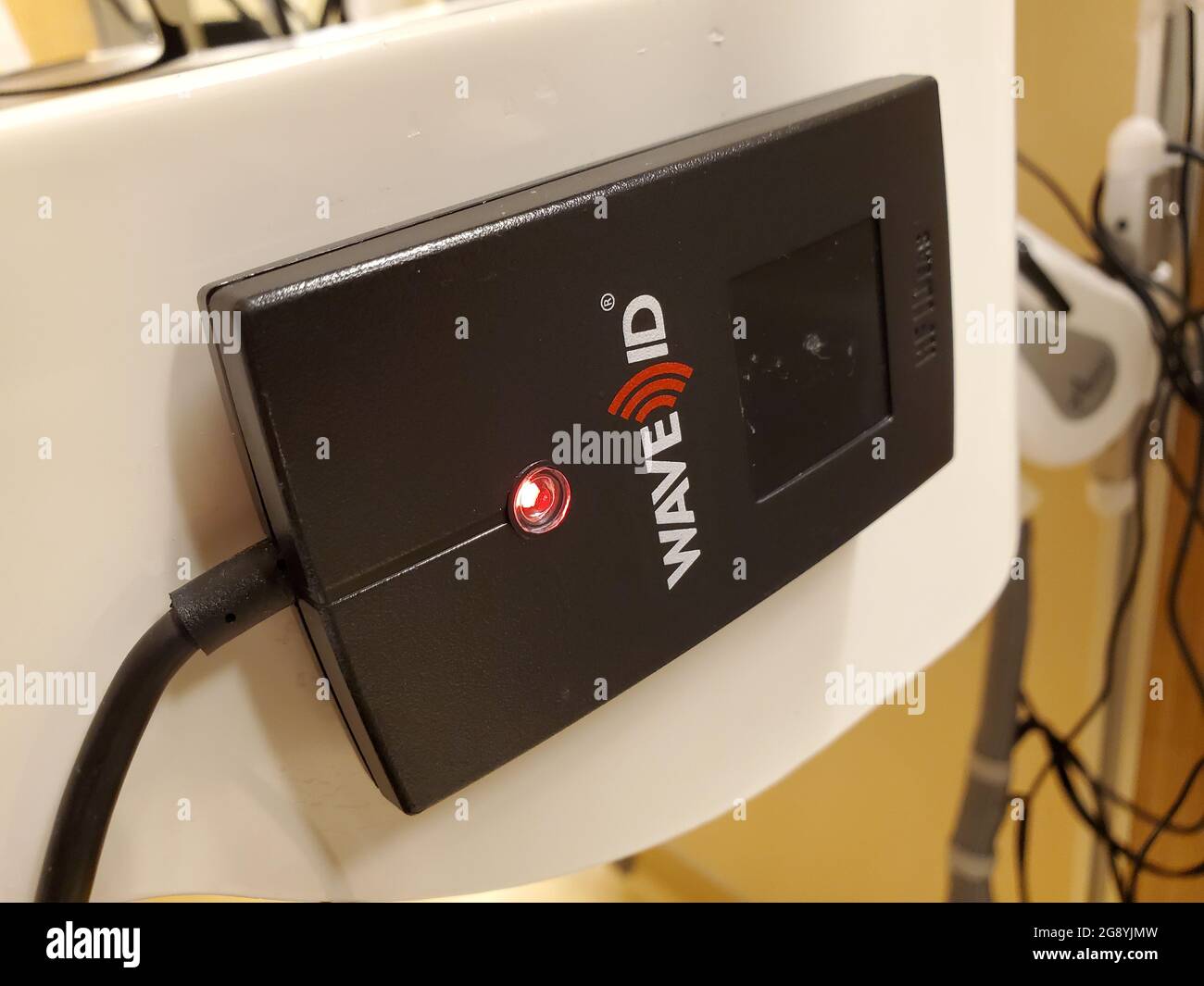 Close-up of a mounted 'Wave ID' contactless identification card reader in a medical setting in San Francisco, California, April 18, 2021. (Photo by Smith Collection/Gado/Sipa USA) Stock Photo