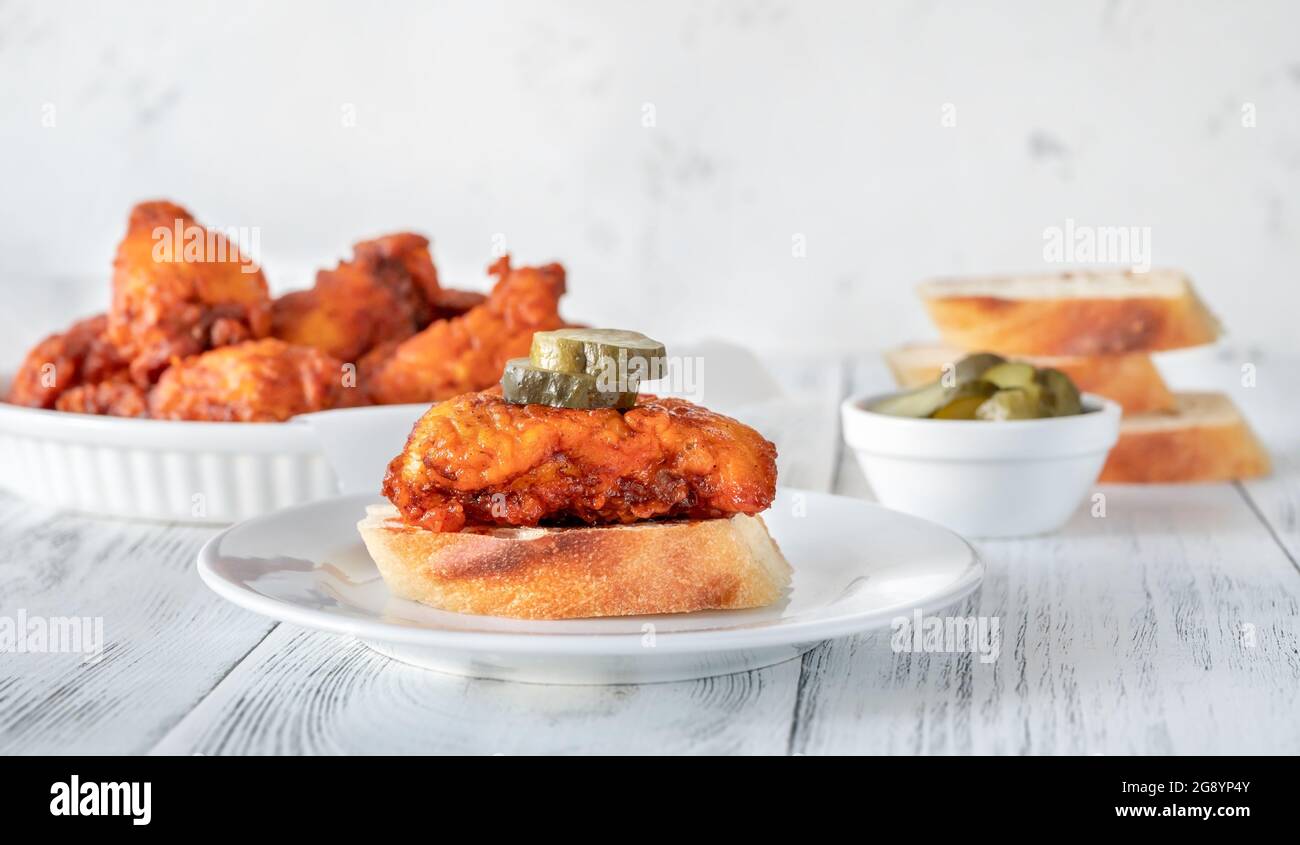 Nashville Hot Chicken covered in cayenne pepper sauce Stock Photo Alamy