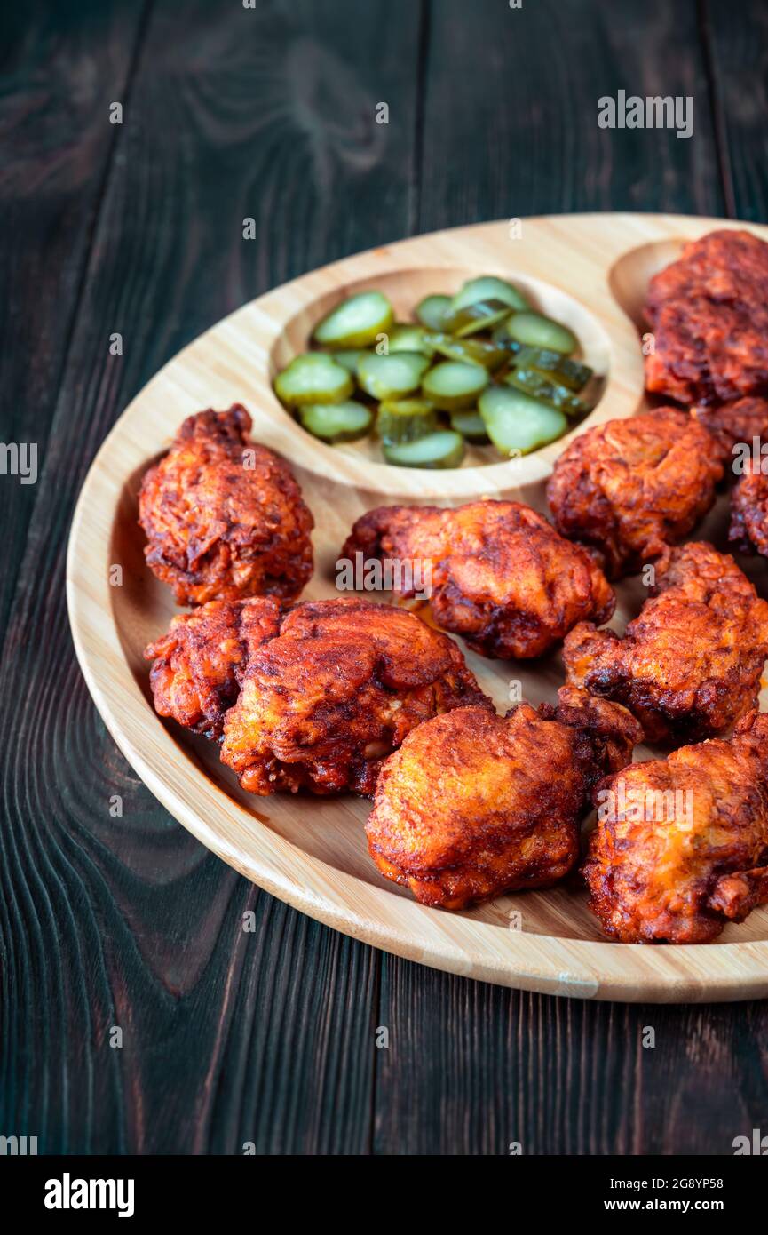 Nashville Hot Chicken covered in cayenne pepper sauce Stock Photo Alamy