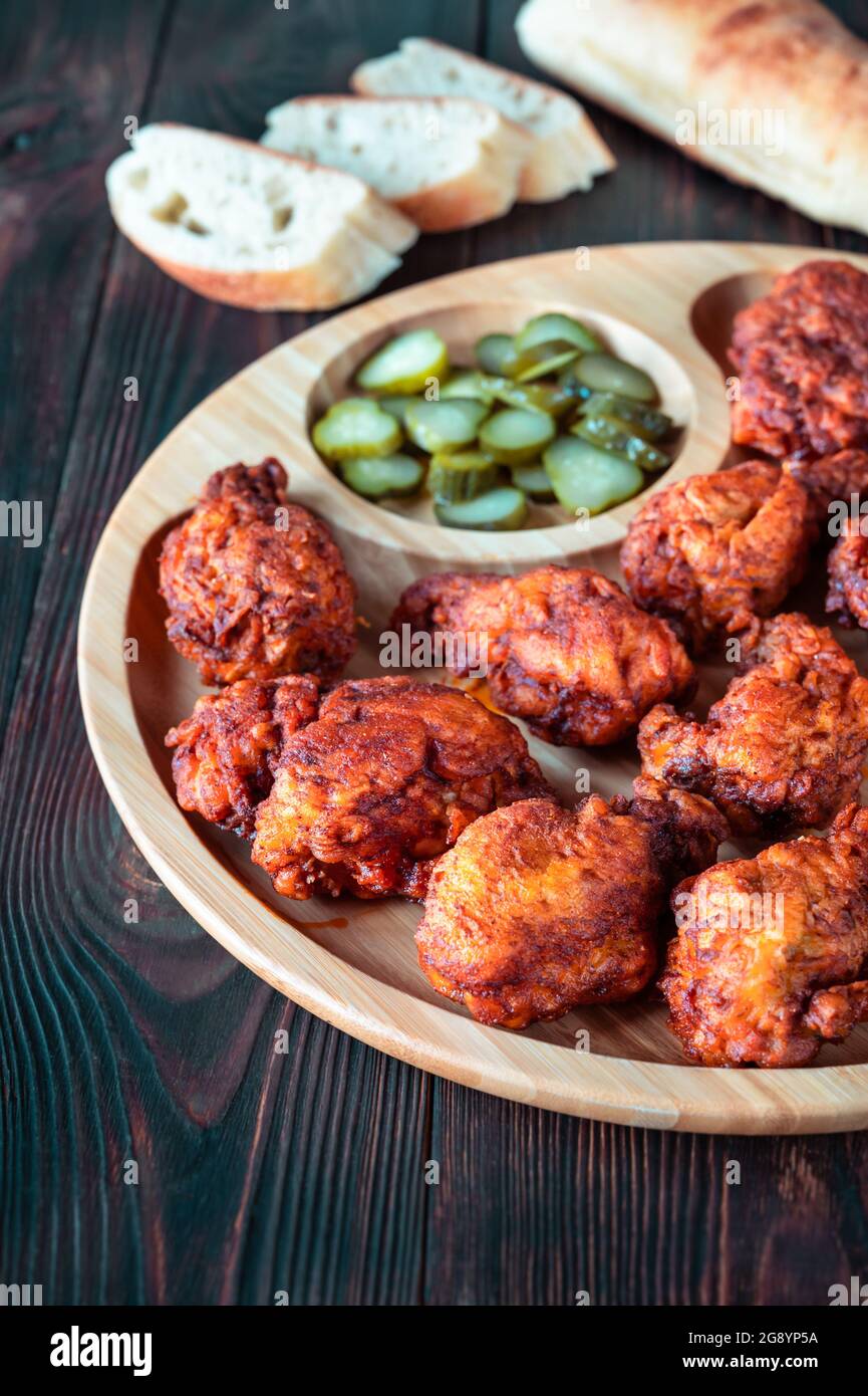 Nashville Hot Chicken covered in cayenne pepper sauce Stock Photo Alamy