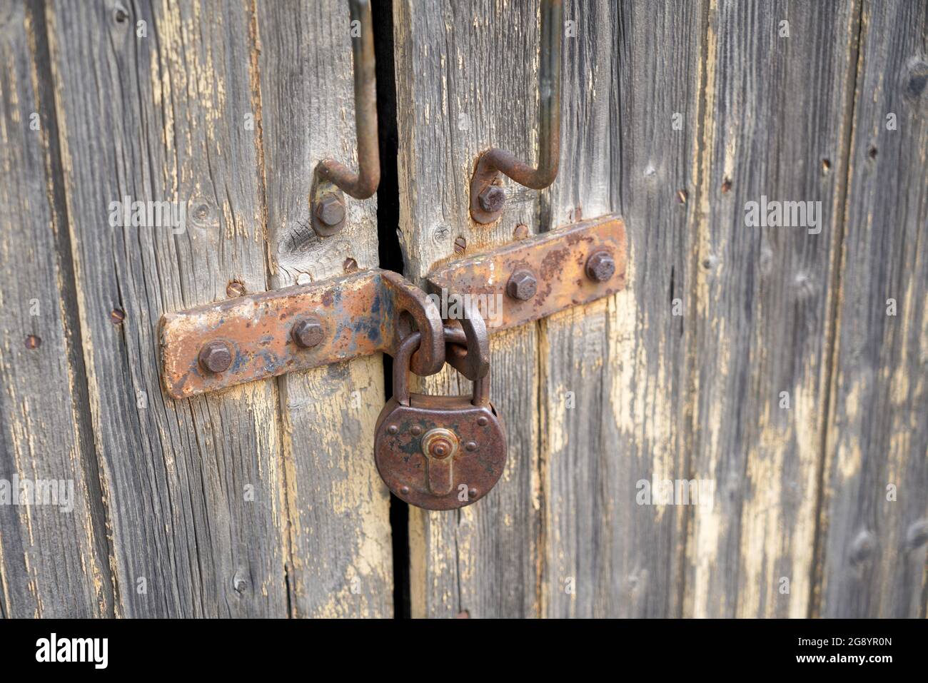 Old padlock with rust but fully functional photographed in the studio