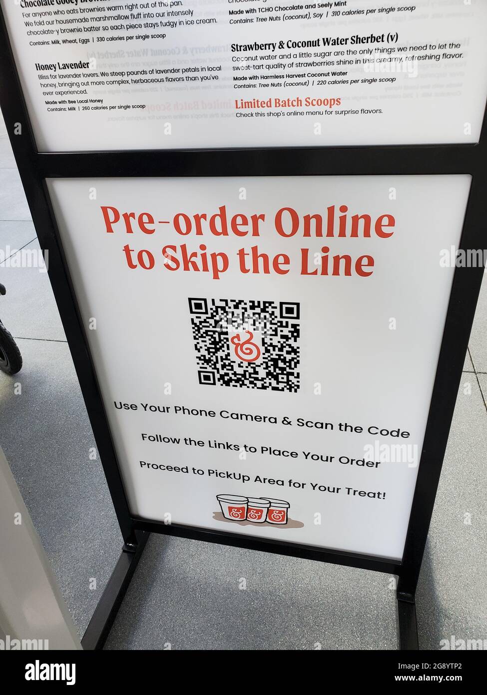 Closeup of a QR coded "Preorder Online to Skip the Line" and menu