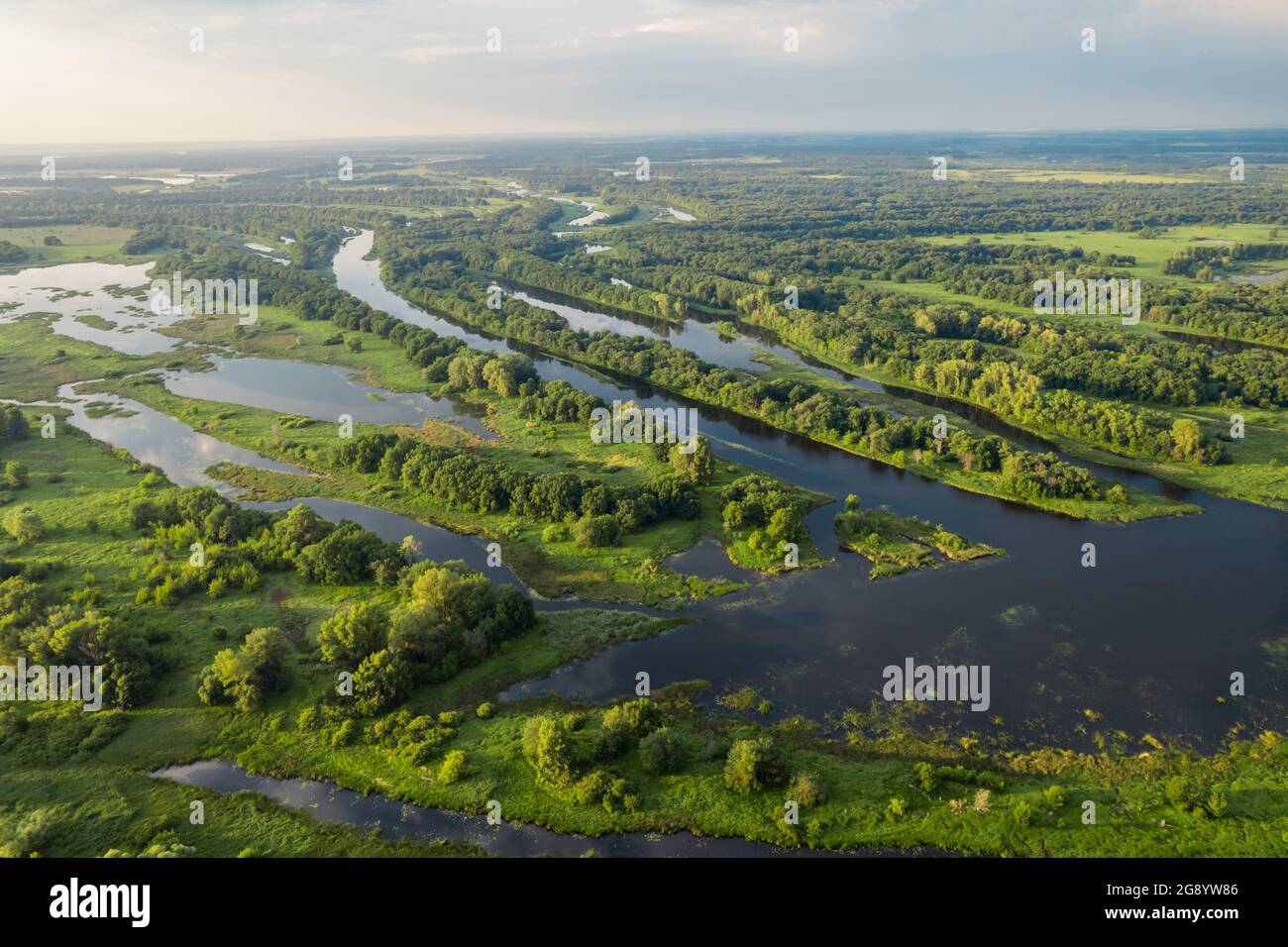 River land with islands, branch, girt with fishing boats and camps, aerial view Stock Photo