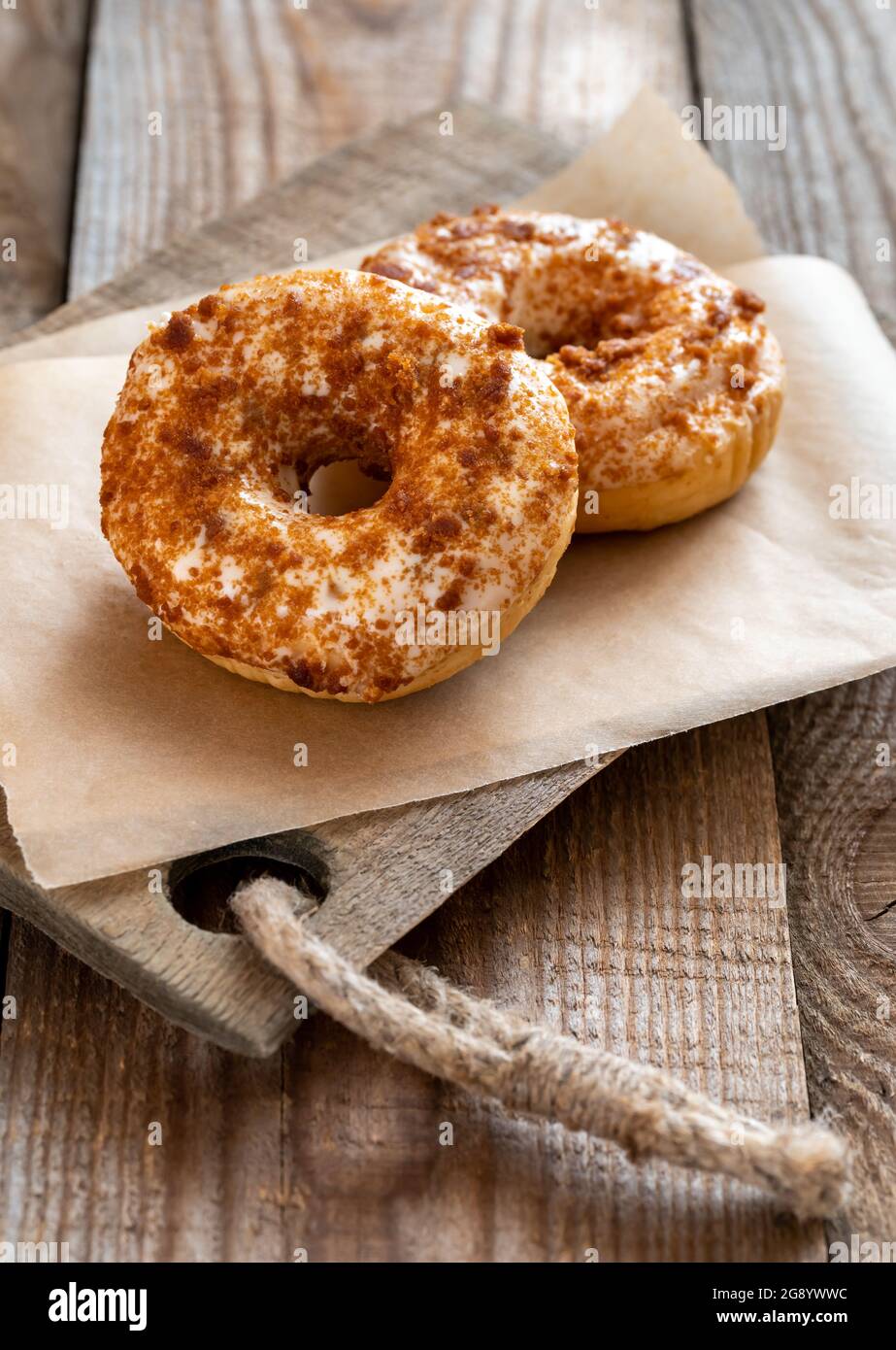 Two donuts on the wooden board Stock Photo