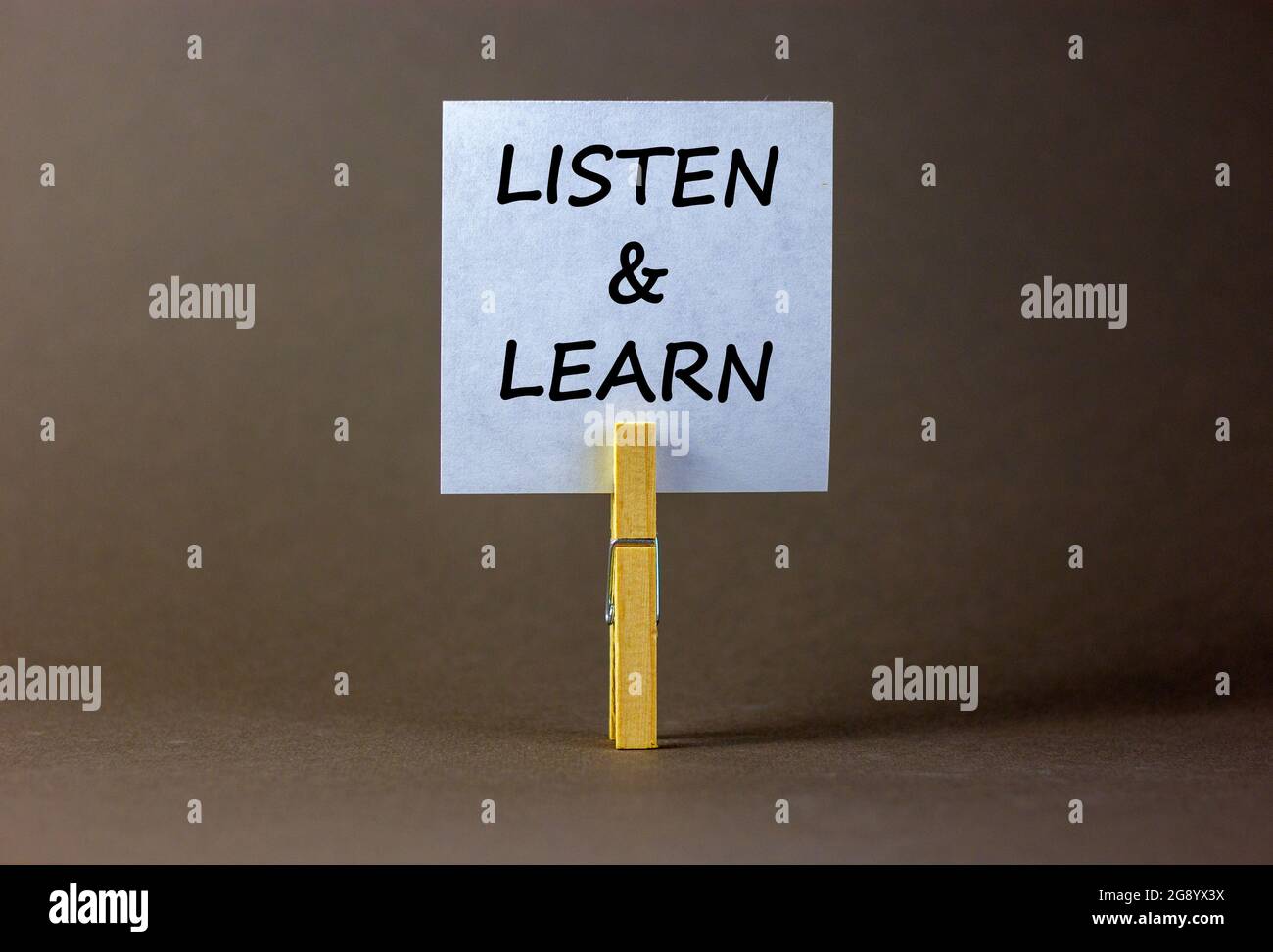 Listen and learn symbol. White paper with words 'Listen and learn ...