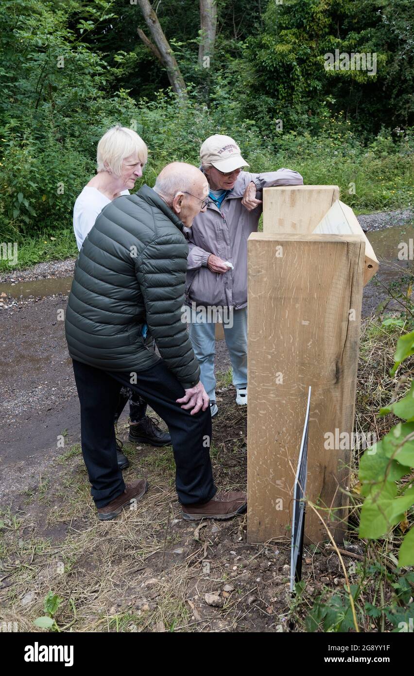 Passers by take an interest in the Information Board related to Bellasis & Operation Anthropoid Stock Photo