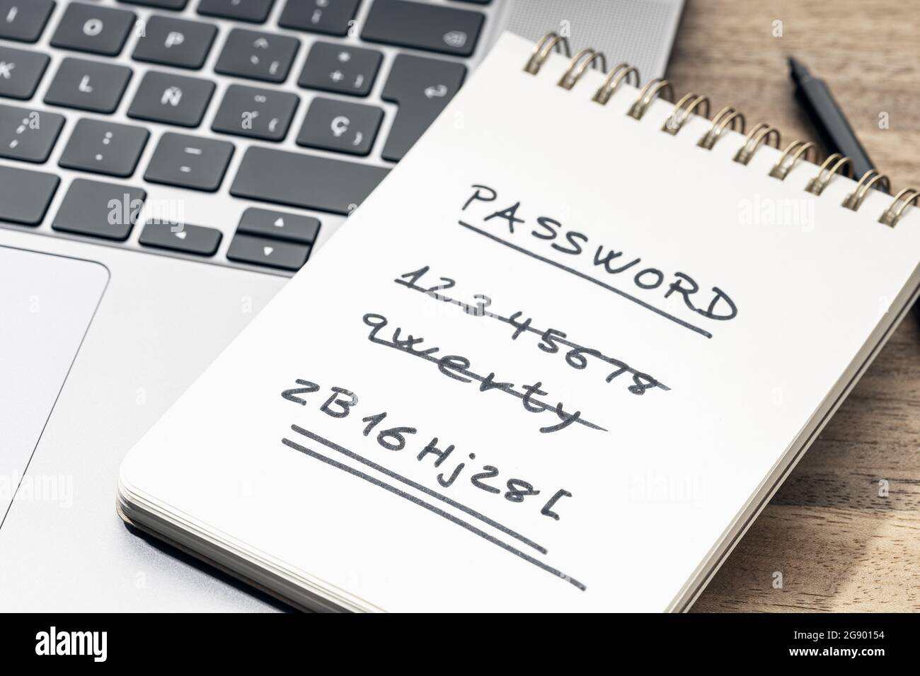 Strong and weak easy Password concept. Handwritten text on notepad on laptop Stock Photo