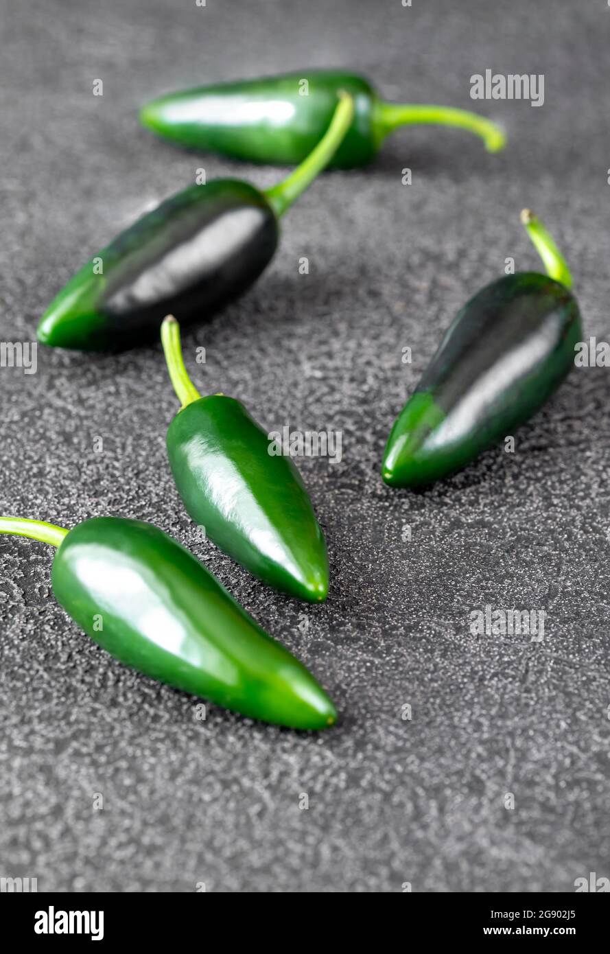 Fresh jalapeno peppers on black background Stock Photo Alamy