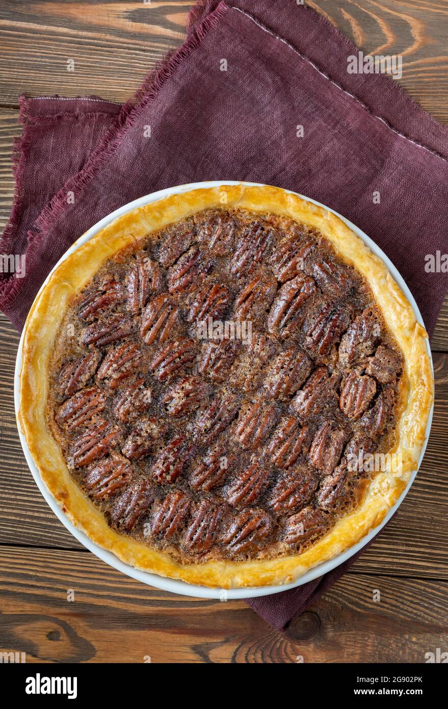 Pecan pie - traditional southern US dessert on wooden table Stock Photo
