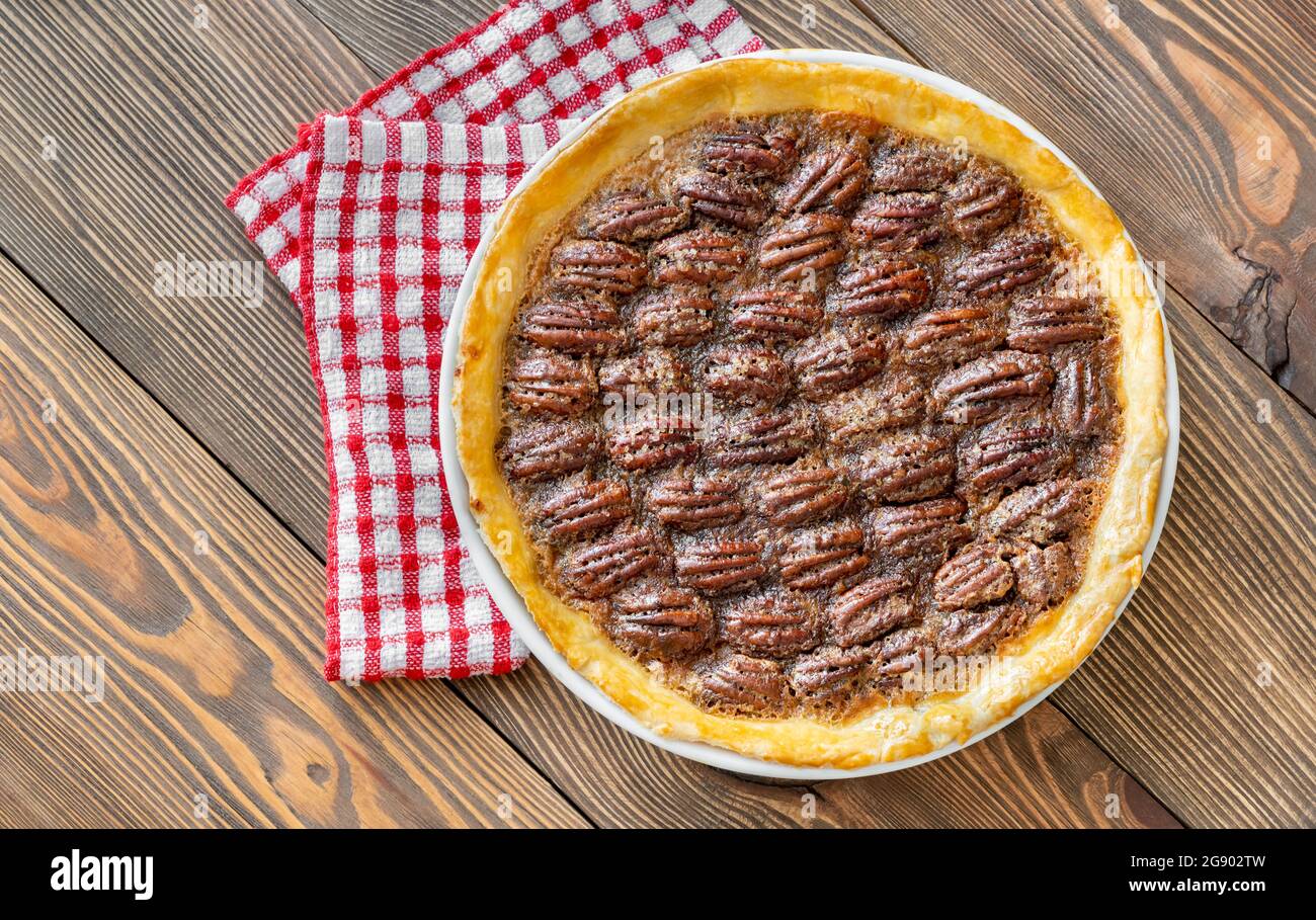 Pecan pie - traditional southern US dessert on wooden table Stock Photo