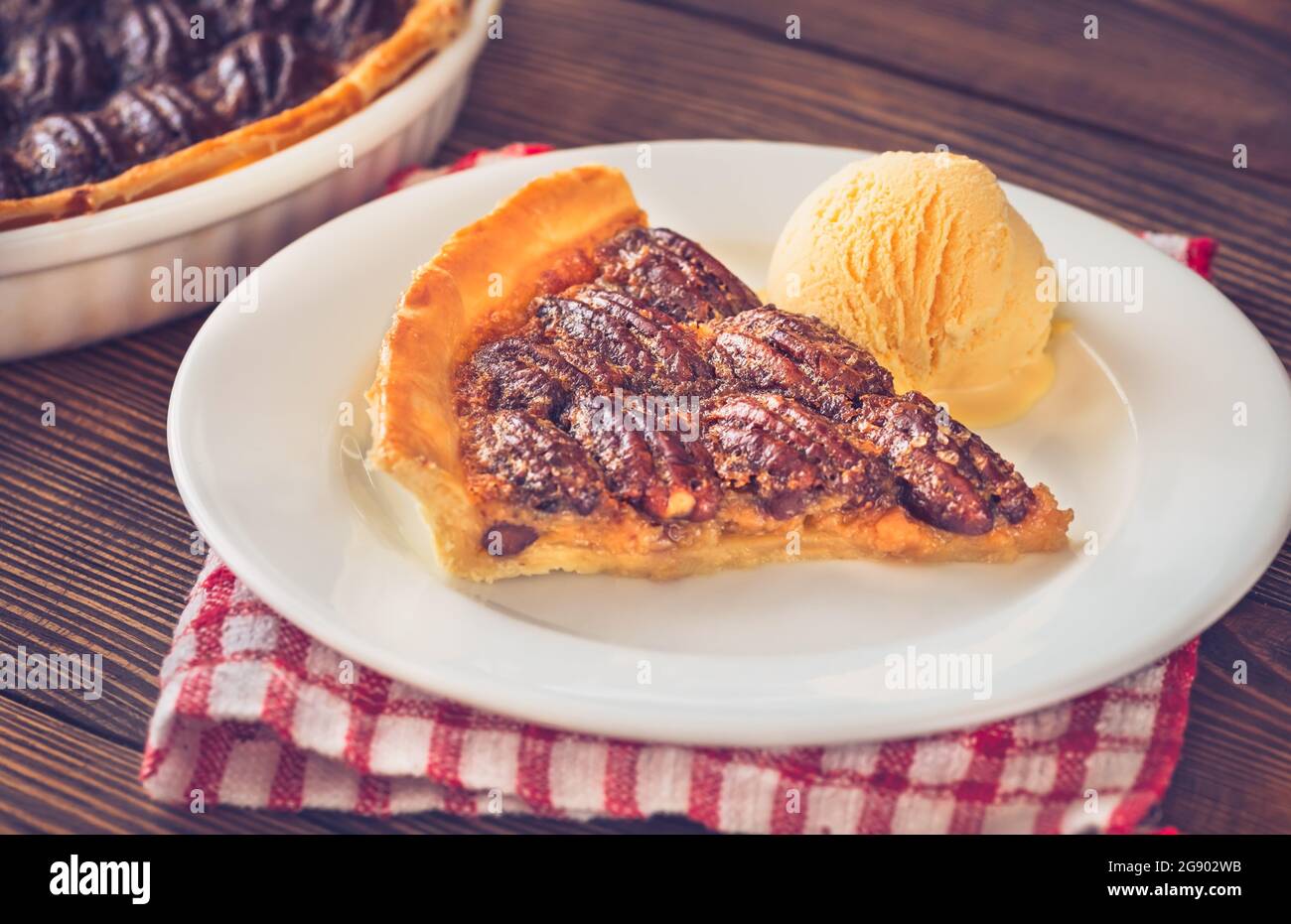 Pecan pie - traditional southern US dessert on wooden table Stock Photo