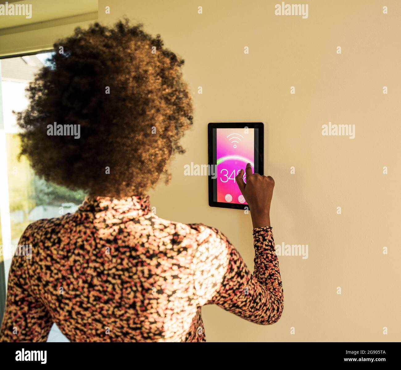 Rear view african woman using hi-res stock photography and images - Alamy