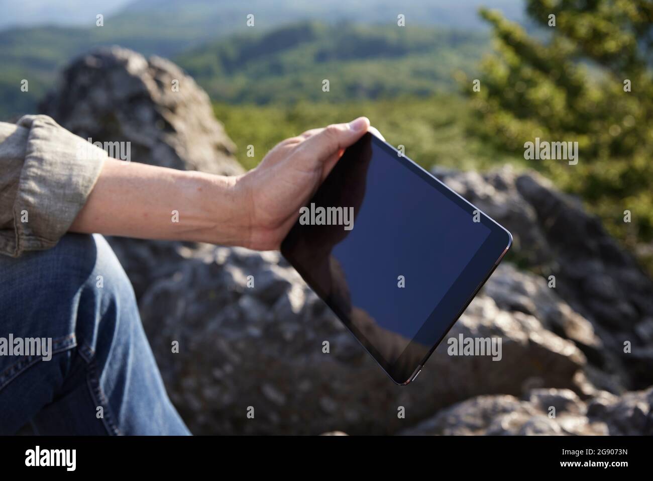 Man holding digital tablet Stock Photo