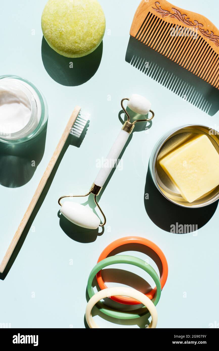 Studio shot of wooden comb, bamboo toothbrush, colorful bracelets, organic soap, shampoo and other eco-friendly self-care products Stock Photo