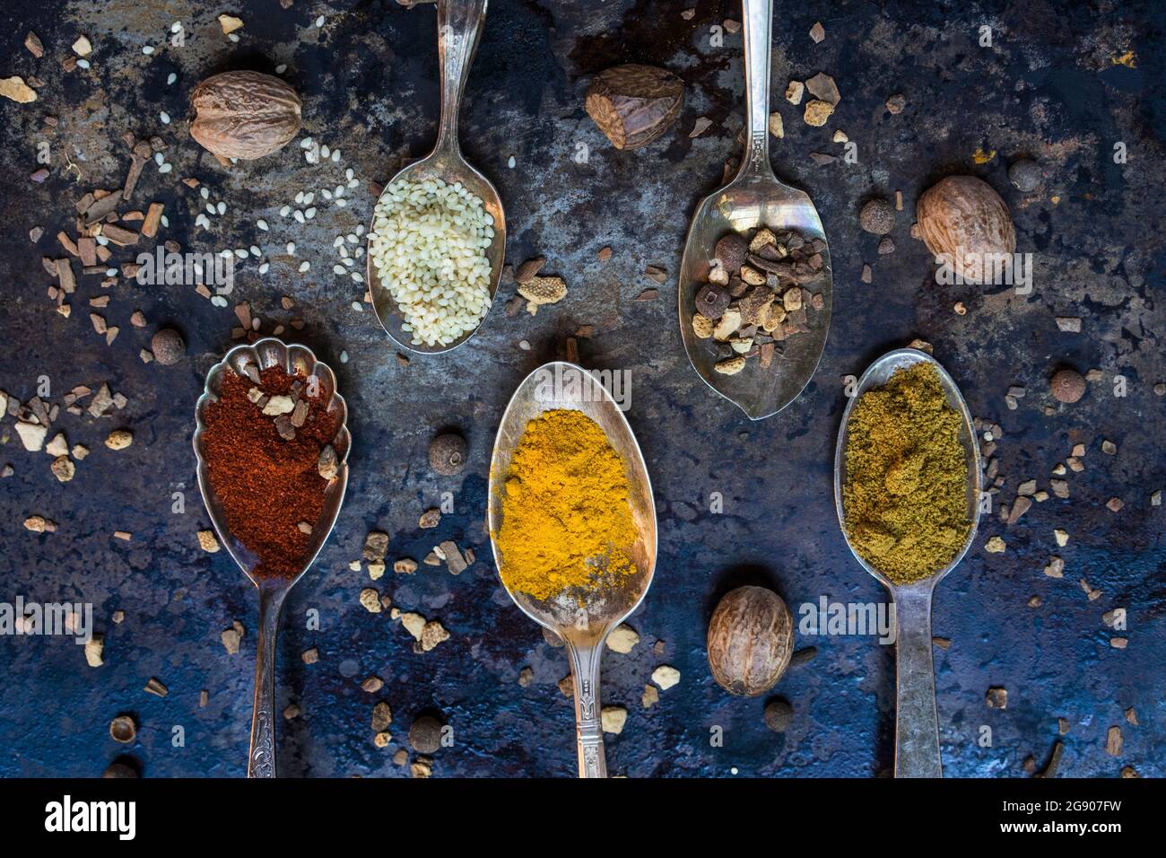 Spoons with various spices and legumes Stock Photo