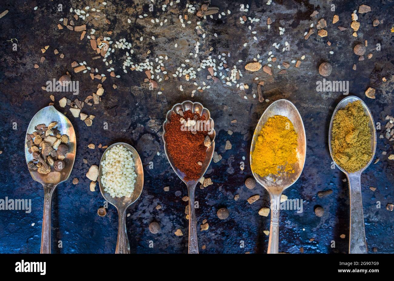 Spoons with various spices and legumes Stock Photo