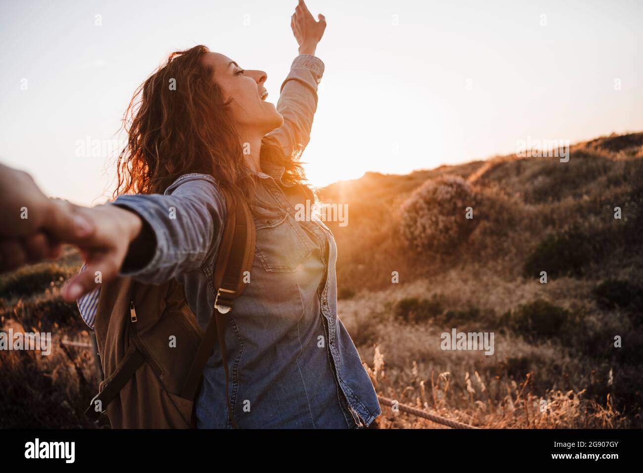 Man raised hands sunset hi-res stock photography and images - Alamy