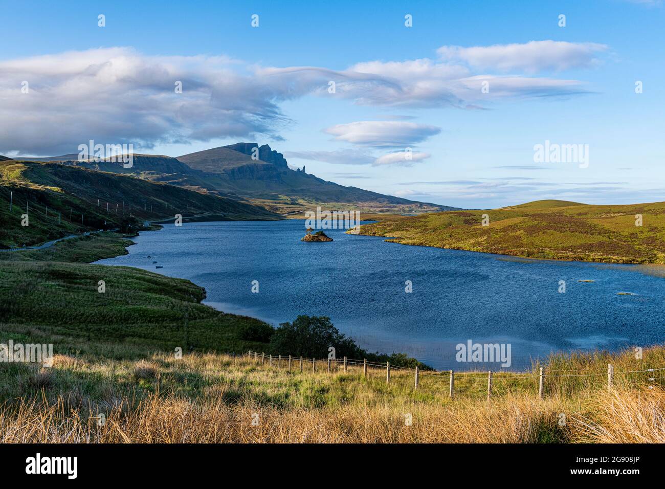 UK, Scotland, Clouds over Loch Leathan with Old Man of Storr in background Stock Photo