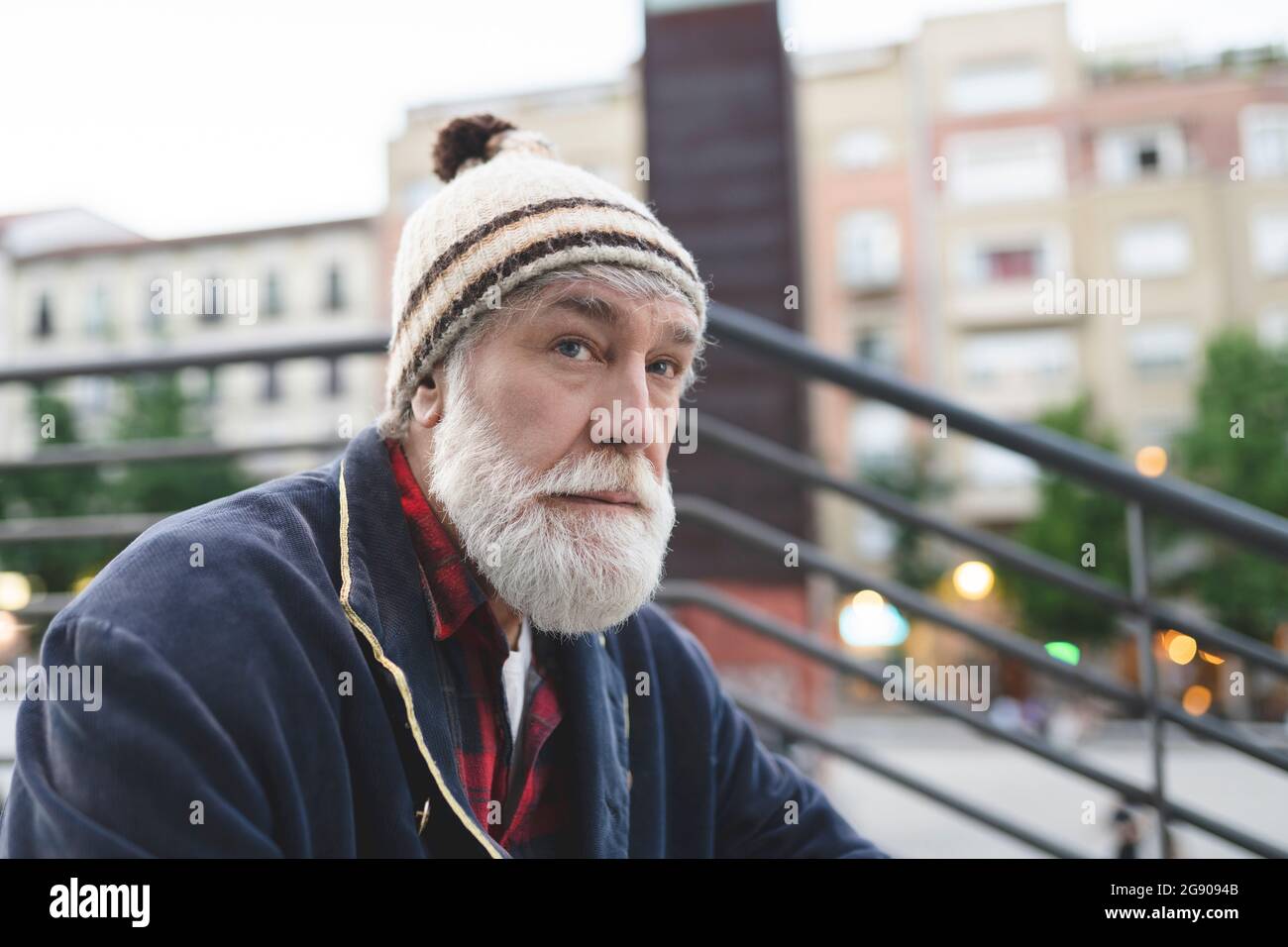 Mature man with white beard wearing knit hat Stock Photo