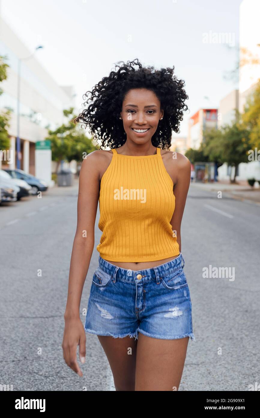 Happy black woman walking street hi-res stock photography and images ...