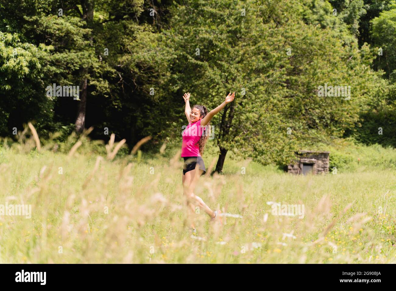Woman arms raised in forest hi-res stock photography and images - Alamy