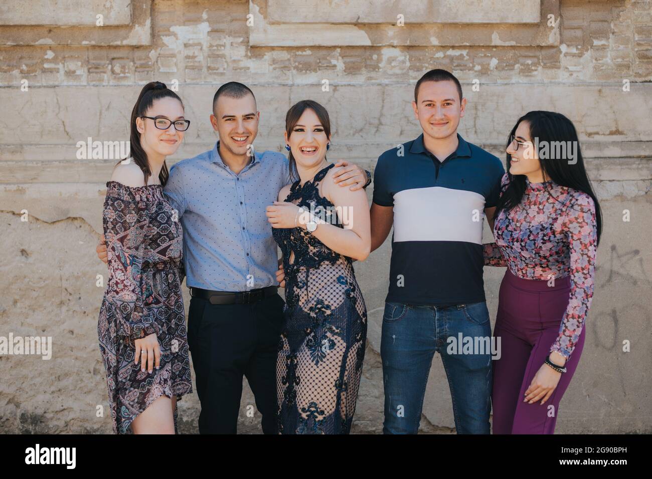 Group of cheerful friends posing together outdoors Stock Photo - Alamy