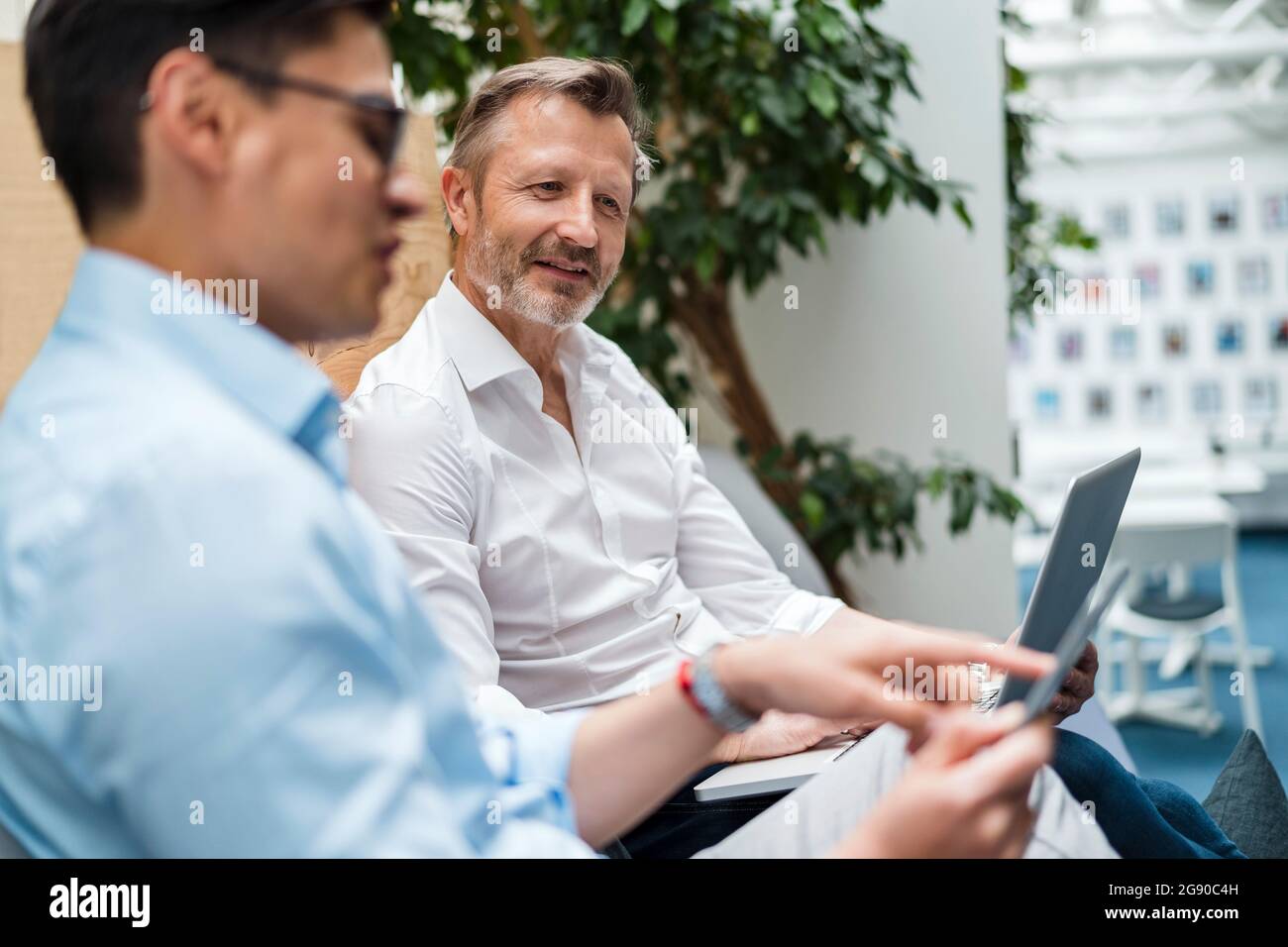 Male professional team using digital tablet at office Stock Photo