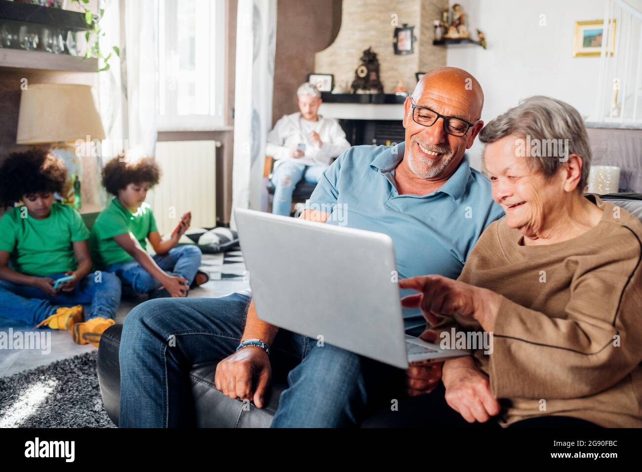 Multi-ethnic family spending leisure time at home Stock Photo