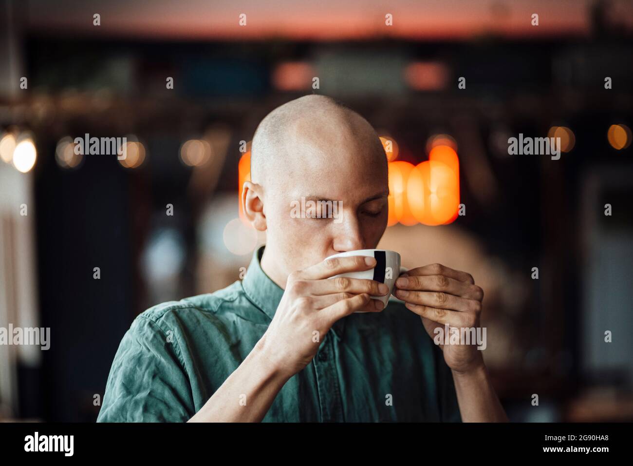 Male cafe owner drinking coffee Stock Photo