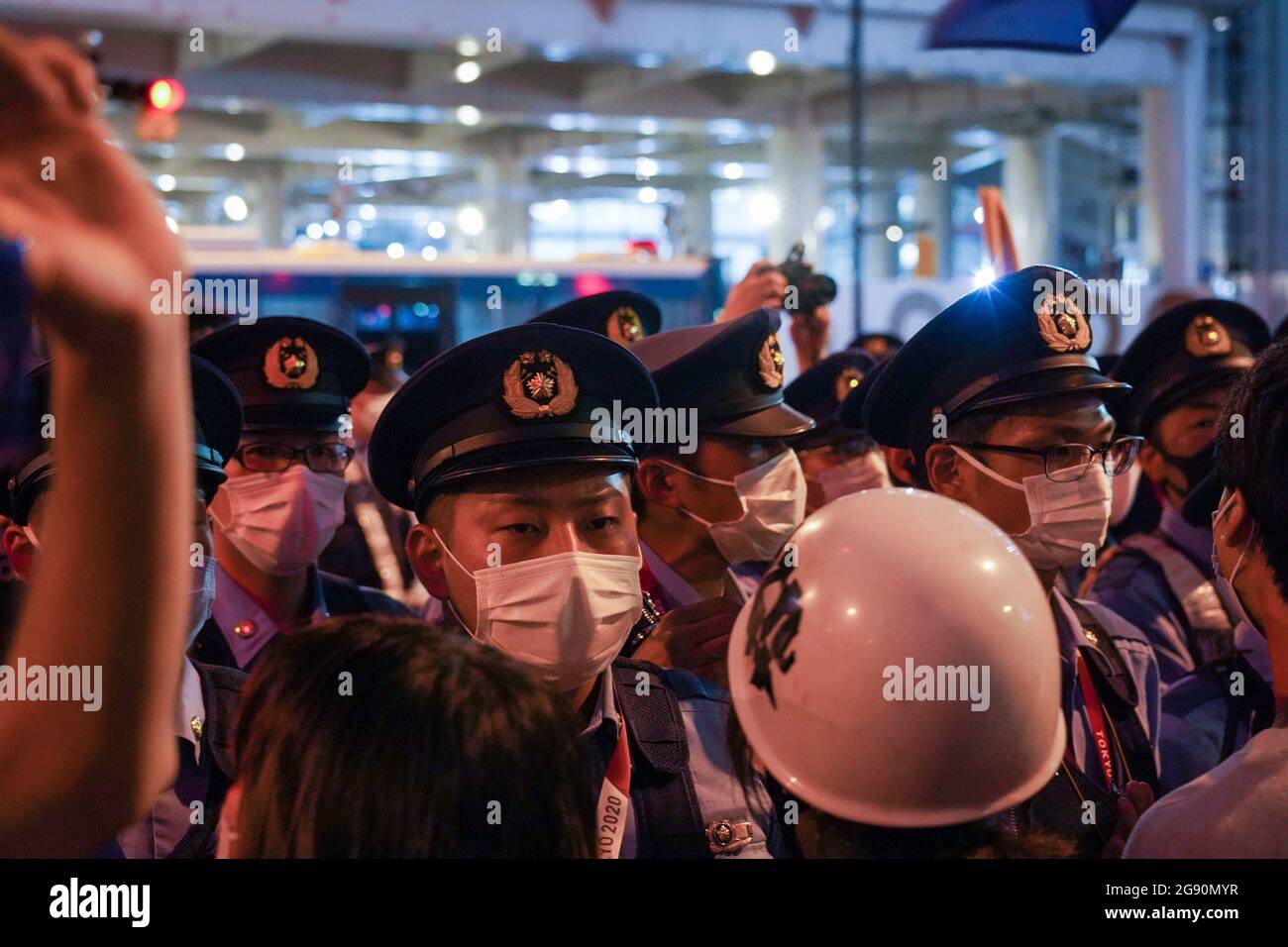 Police officers stand on guard outside Tokyo Olympic stadium as Anti(00)