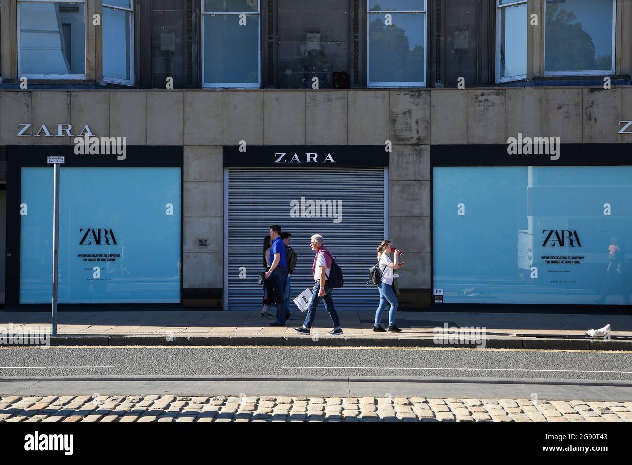 People walk past a branch of Zara in Edinburgh, Scotland Stock Photo - Alamy